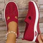 Red orthopedic knit slip-on sneakers with breathable toe and side cutouts