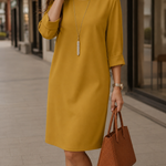 Mustard midi shift dress with 3/4 sleeves and round neckline