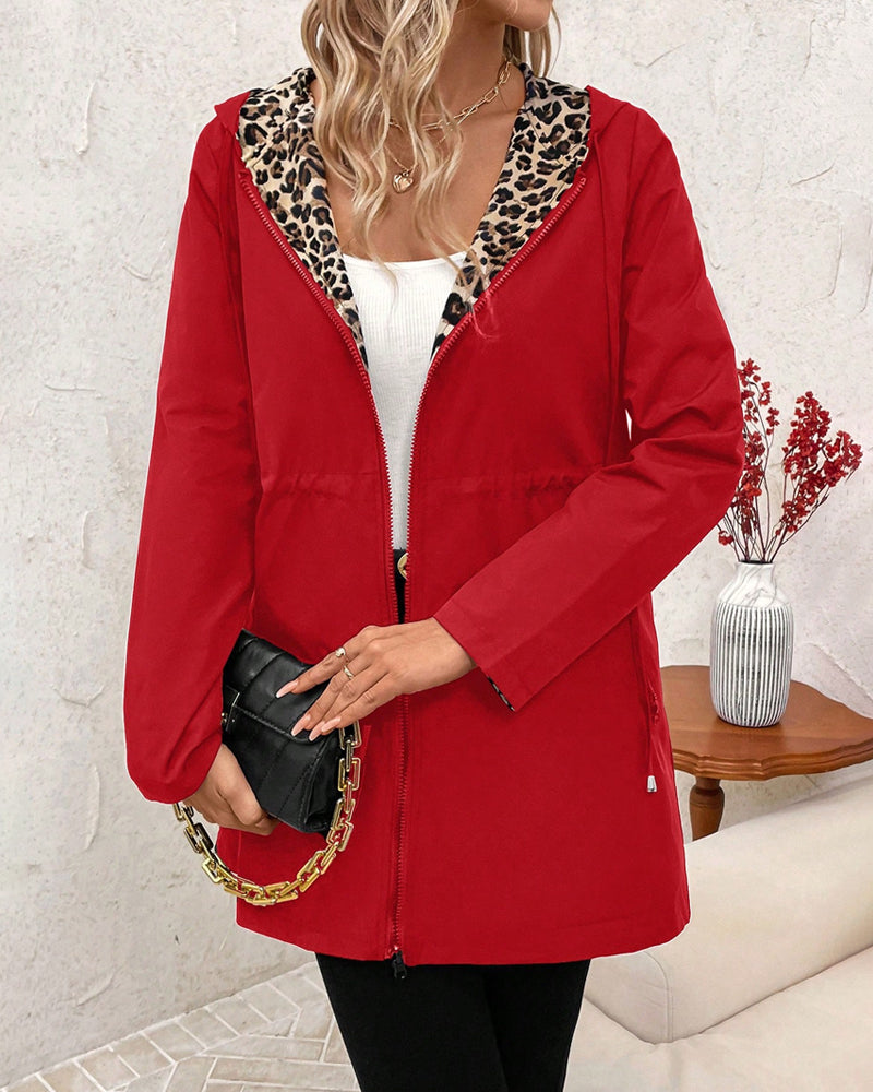 Red reversible hooded jacket with leopard-print hood lining and zip front
