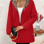 Red reversible hooded jacket with leopard-print hood lining and zip front