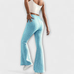 Light blue ribbed knit flared pants with high rise and bell-shaped hem