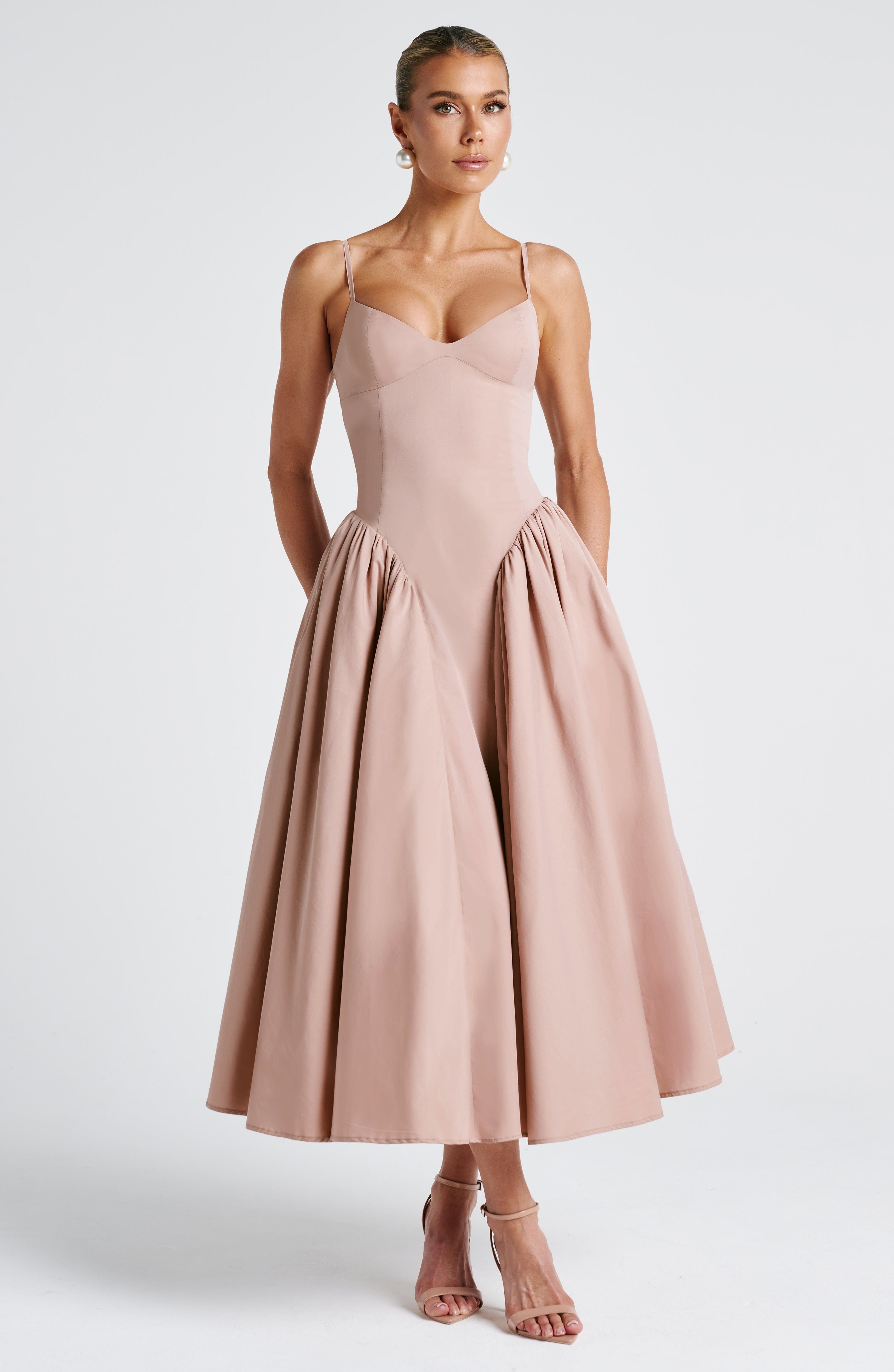 Women’s blush midi dress with fitted bodice and full gathered skirt