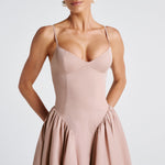 Women’s blush midi dress with thin straps and fitted bodice, close-up