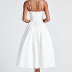 Women’s white midi dress with thin straps and full gathered skirt, back view