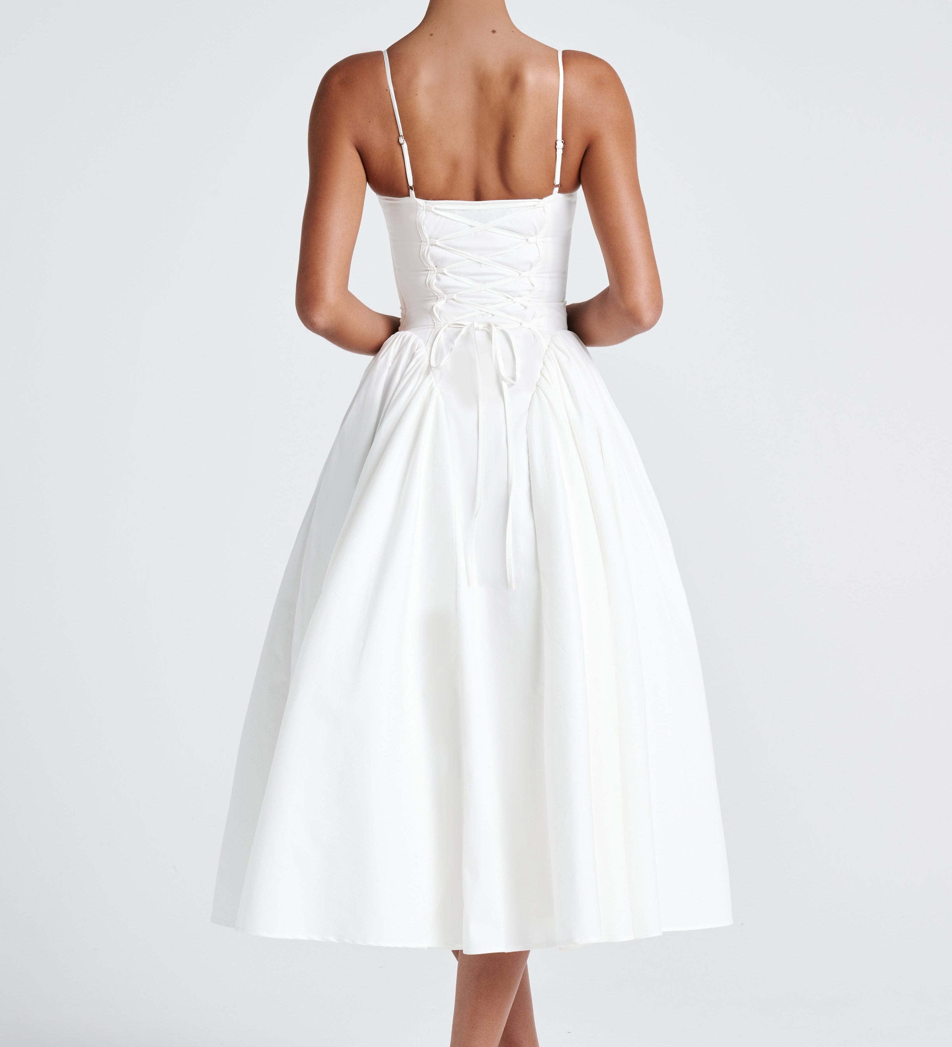 Women’s white midi dress with thin straps and full gathered skirt, back view