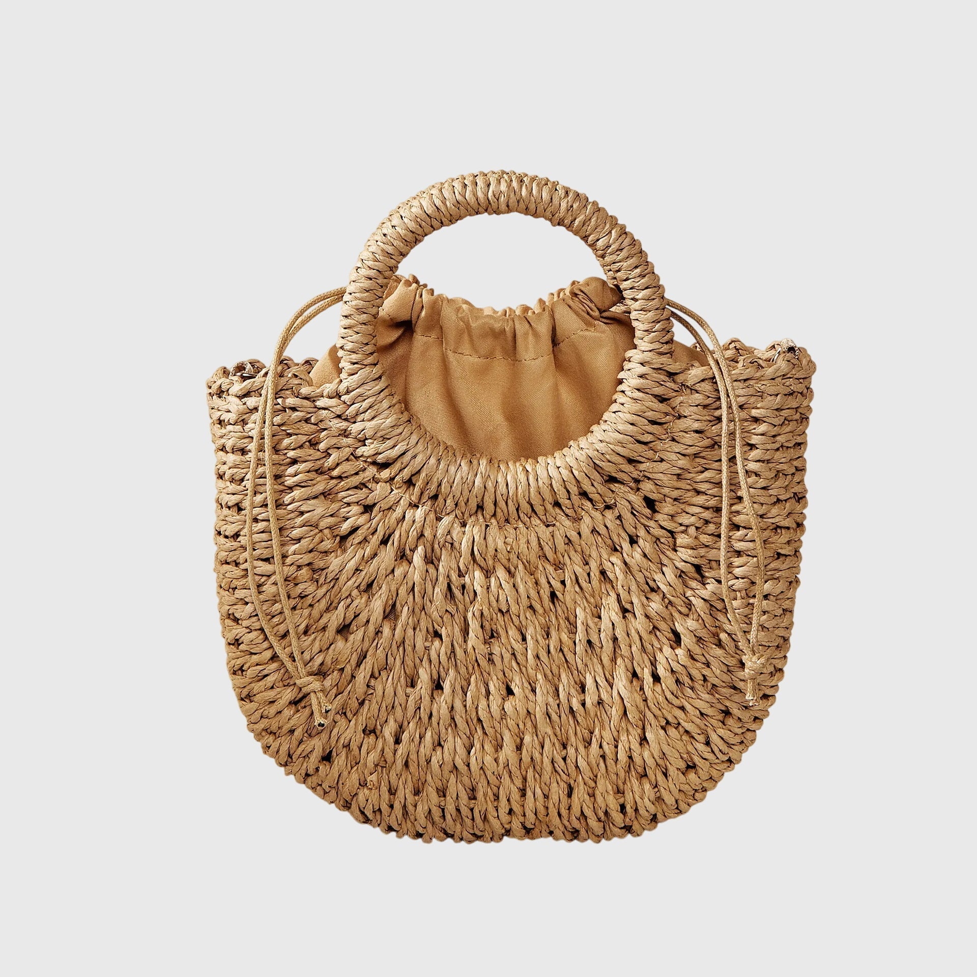 Beige woven straw shoulder bag with fabric-lined top and ring handles, side straps.