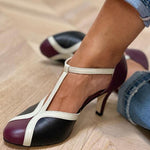 Retro T-bar pumps with white straps, dark toe, and slim high heel