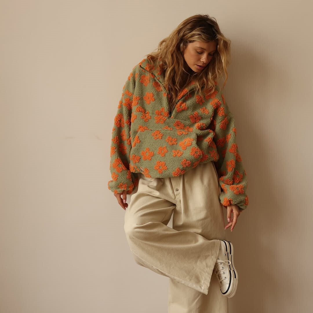 Green fuzzy fleece half-zip hoodie with orange flower print and loose long sleeves