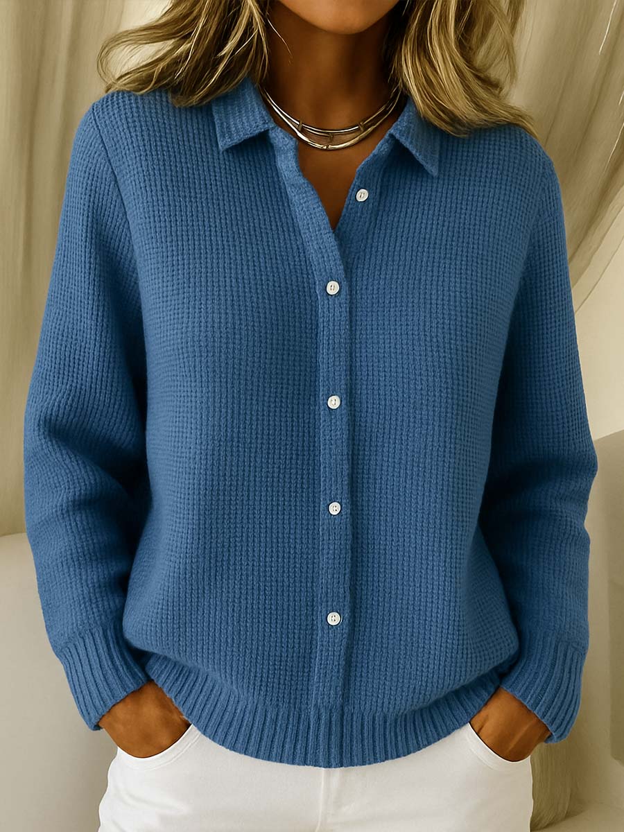 Light blue knit cardigan with collared button placket and ribbed hem and cuffs.