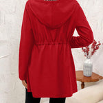 Red reversible hooded jacket with gathered waist, full sleeves, and front zipper