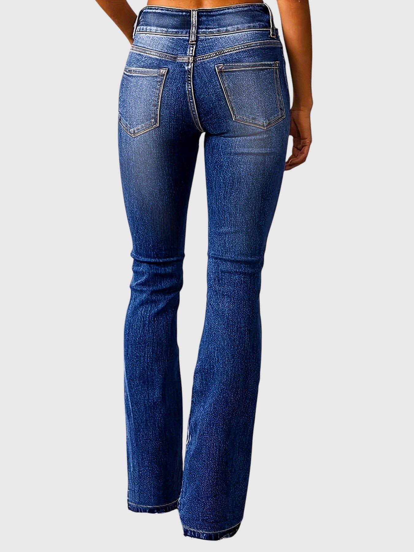 High-waisted slim-fit blue jeans, back view with two patch pockets and belt loops