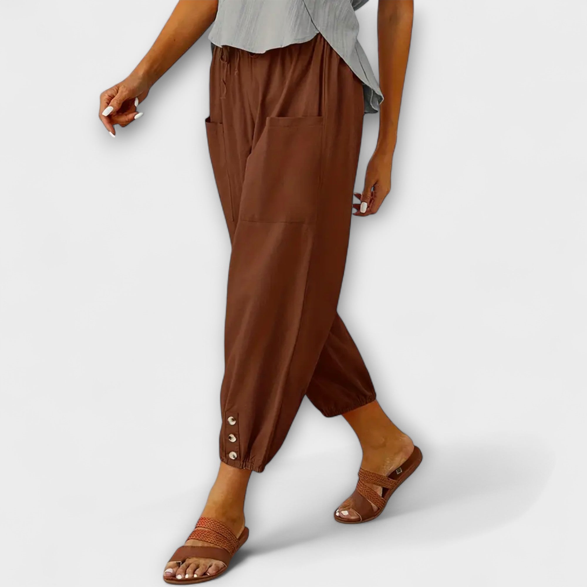 Brown harem pants with side pockets and button-tab cuffs, relaxed loose fit