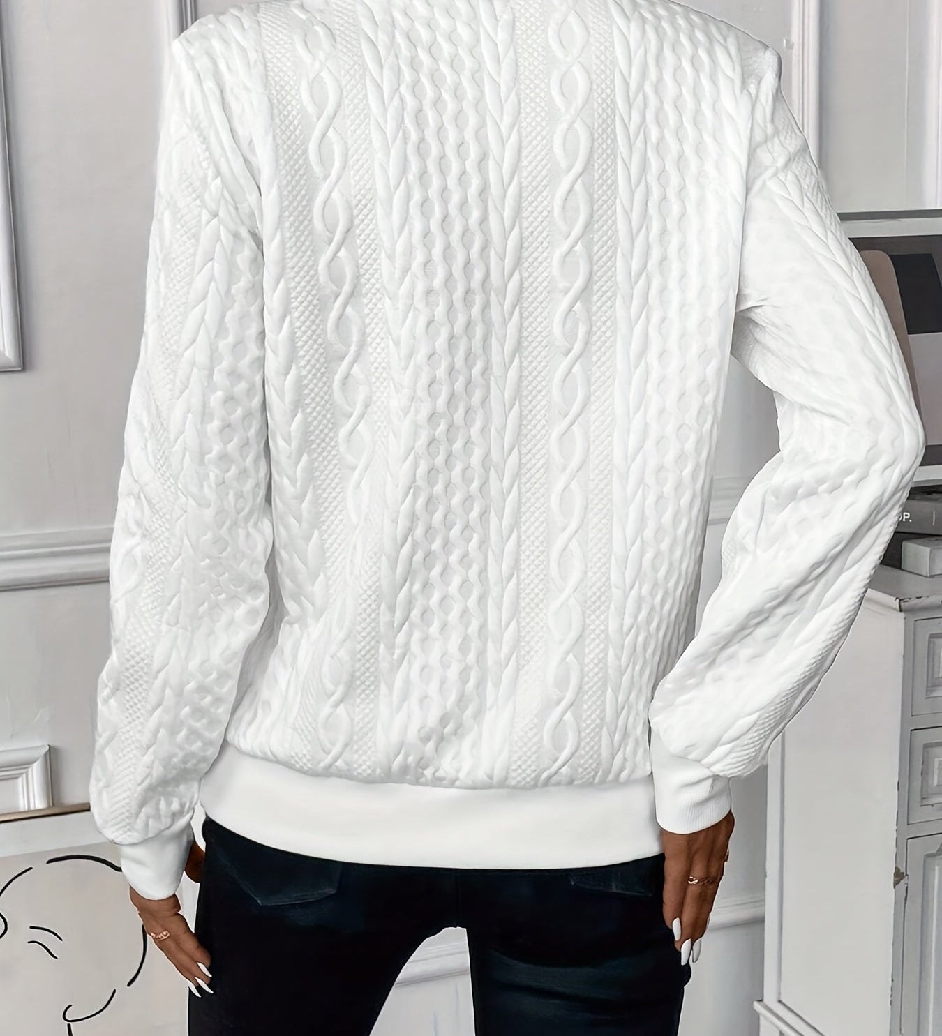 White cable-knit zip-front sweater, back view, long sleeves with textured braid pattern.