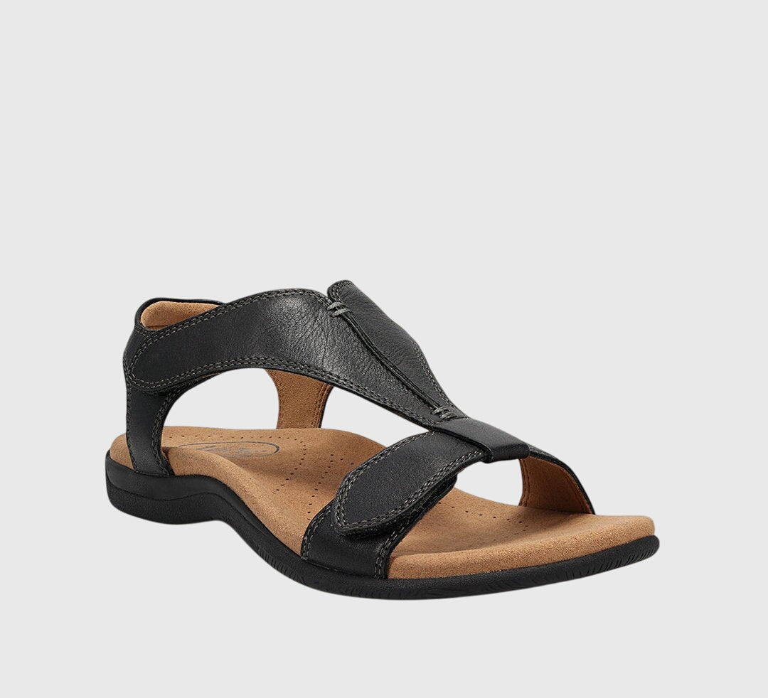 Black slide-style orthopedic sandals with open toe and padded straps