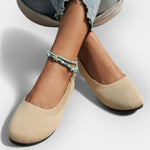 Beige knit slip-on ballet flats with rounded toe and flat sole