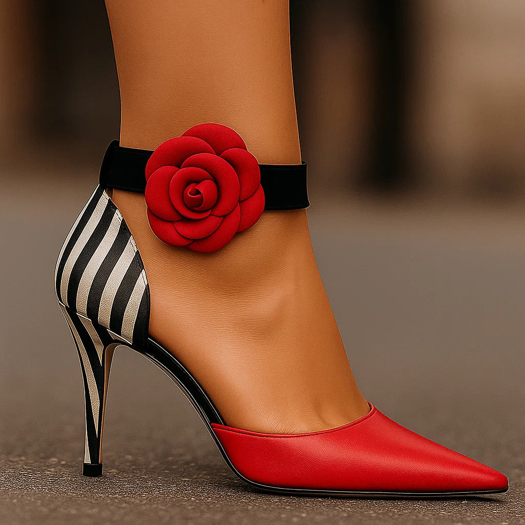 Red pointed-toe high-heel pumps with black ankle strap, zebra back panel, rose applique