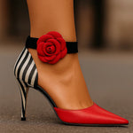 Red pointed-toe high-heel pumps with black ankle strap, zebra back panel, rose applique