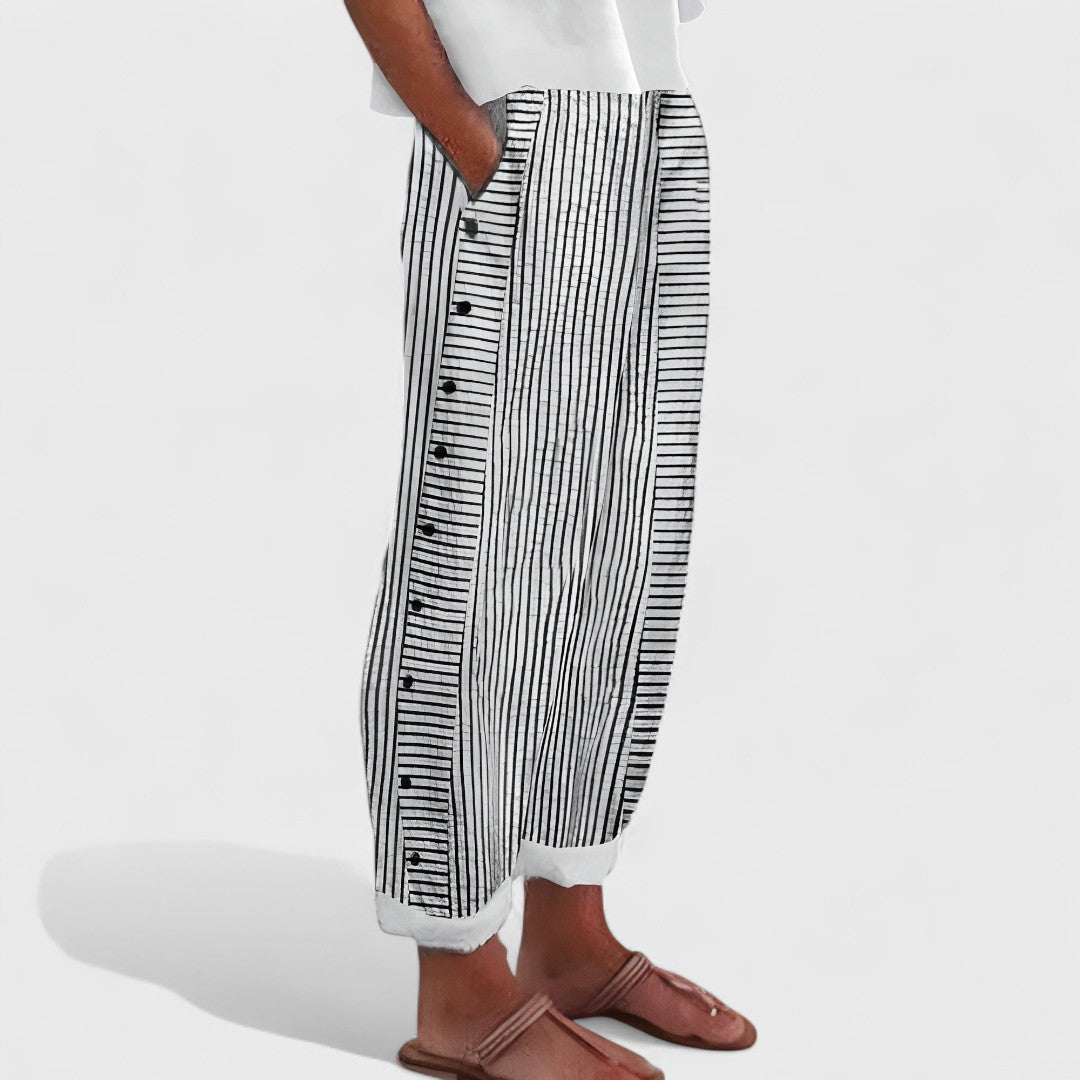 Black-and-white striped linen pants with button placket and relaxed wide leg