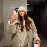 Light beige sherpa zip-up winter jacket with stand collar and two front flap pockets