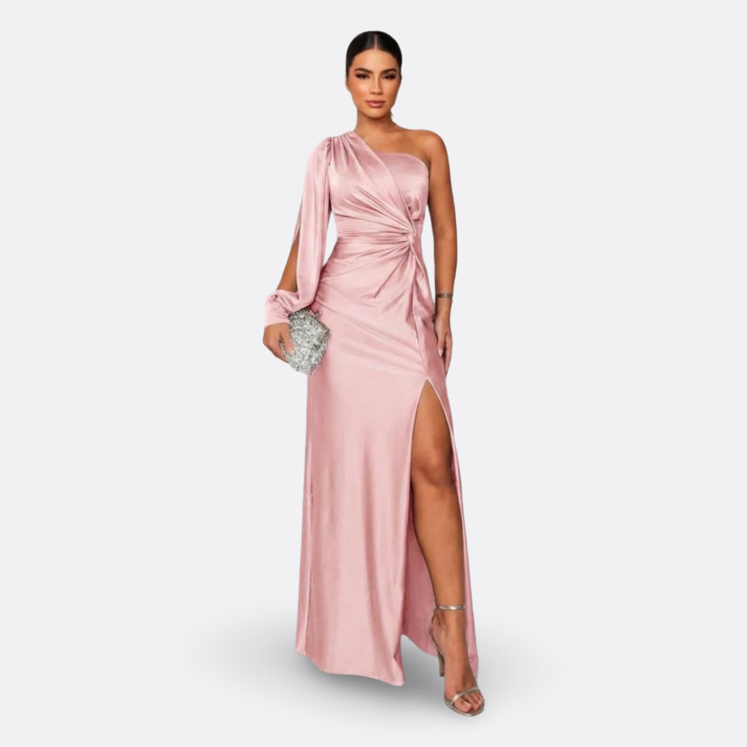 Blush pink one-shoulder maxi dress with draped sleeve and side slit, ruched waist