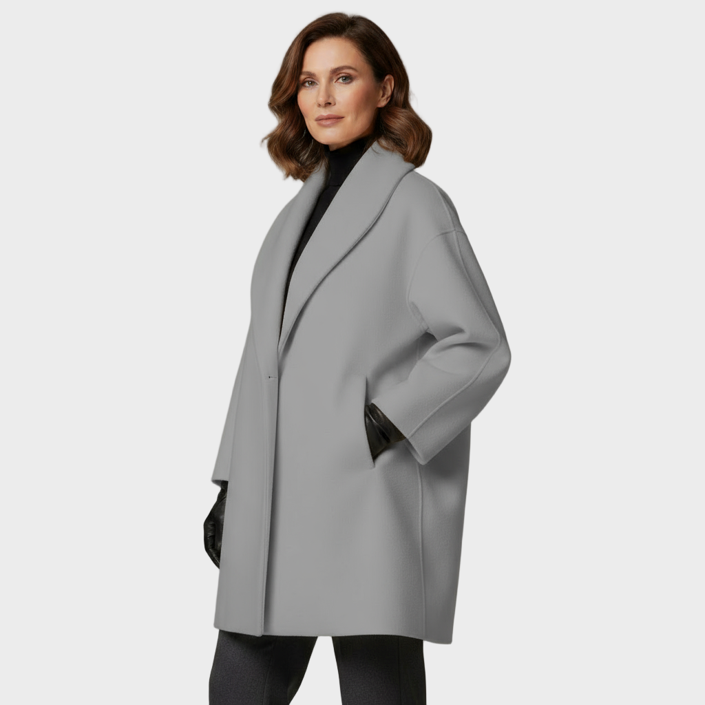 Light gray tailored overcoat with notched lapel, long sleeves, button-front closure