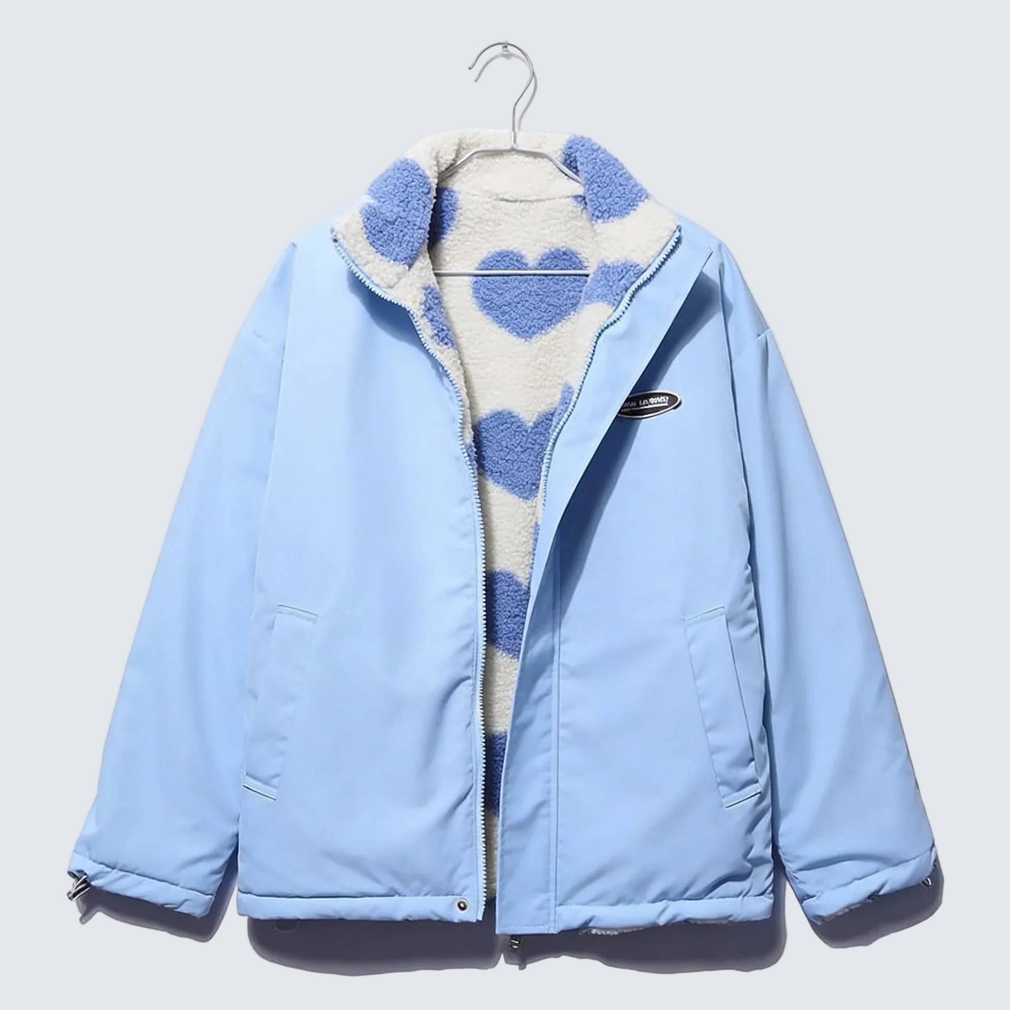 Light blue reversible winter jacket with heart-pattern fleece lining and full front zip