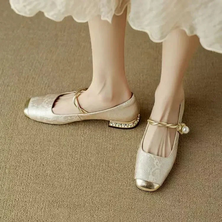 Eirene ballet flats in pale beige with gold toe cap and pearl ankle strap