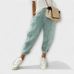 Comfort striped pants in green with light vertical pinstripes, cuffed hems