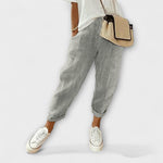Comfort striped pants in dark gray with light vertical pinstripes, cuffed hems