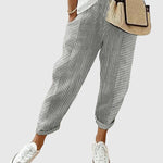 Nina pinstriped trousers in slate gray and white with ankle cuffs