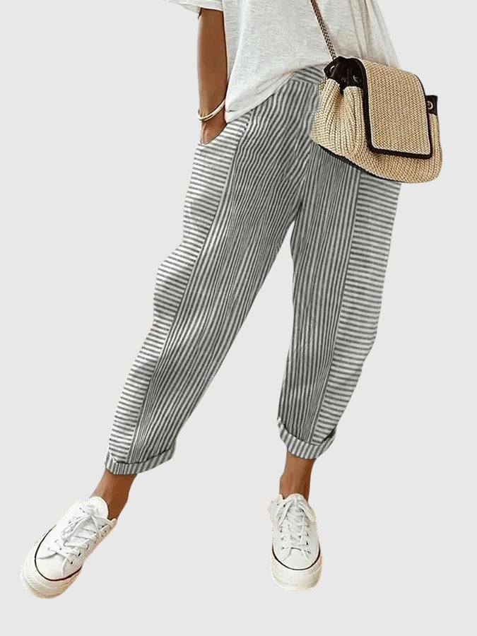 Nina pinstriped trousers in slate gray and white with ankle cuffs