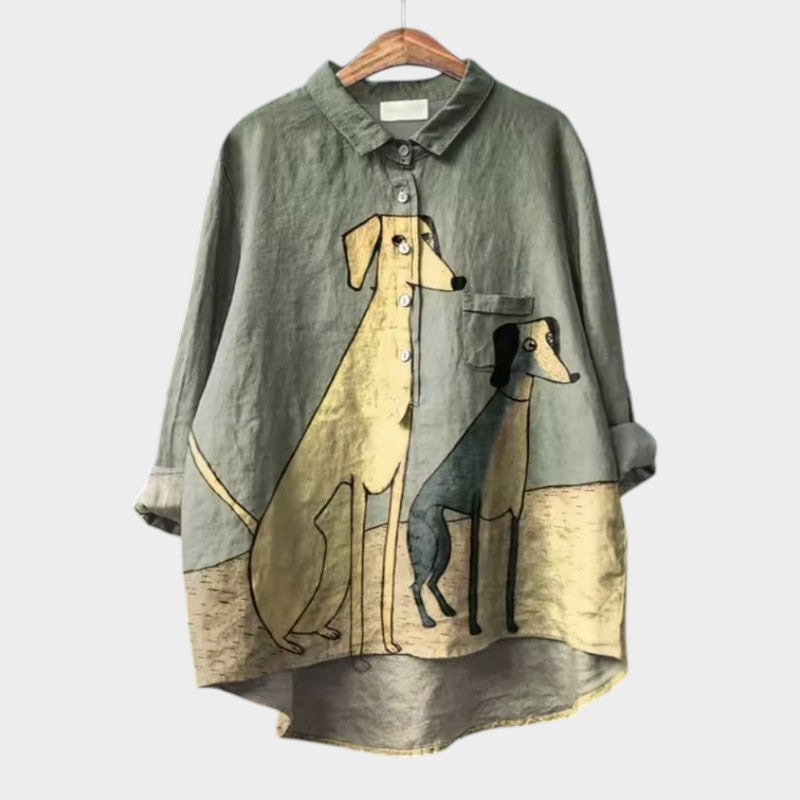Green blouse with collared button front, long sleeves, and dog graphic print