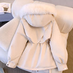 Cream hooded puffer jacket with faux-fur trim and cinched drawstring waist