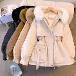 Fur-trimmed hooded puffer jackets in black, tan, and beige on hangers