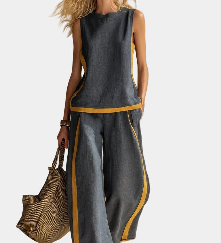 Gray sleeveless linen-and-cotton top and wide-leg pants set, side view with mustard piping