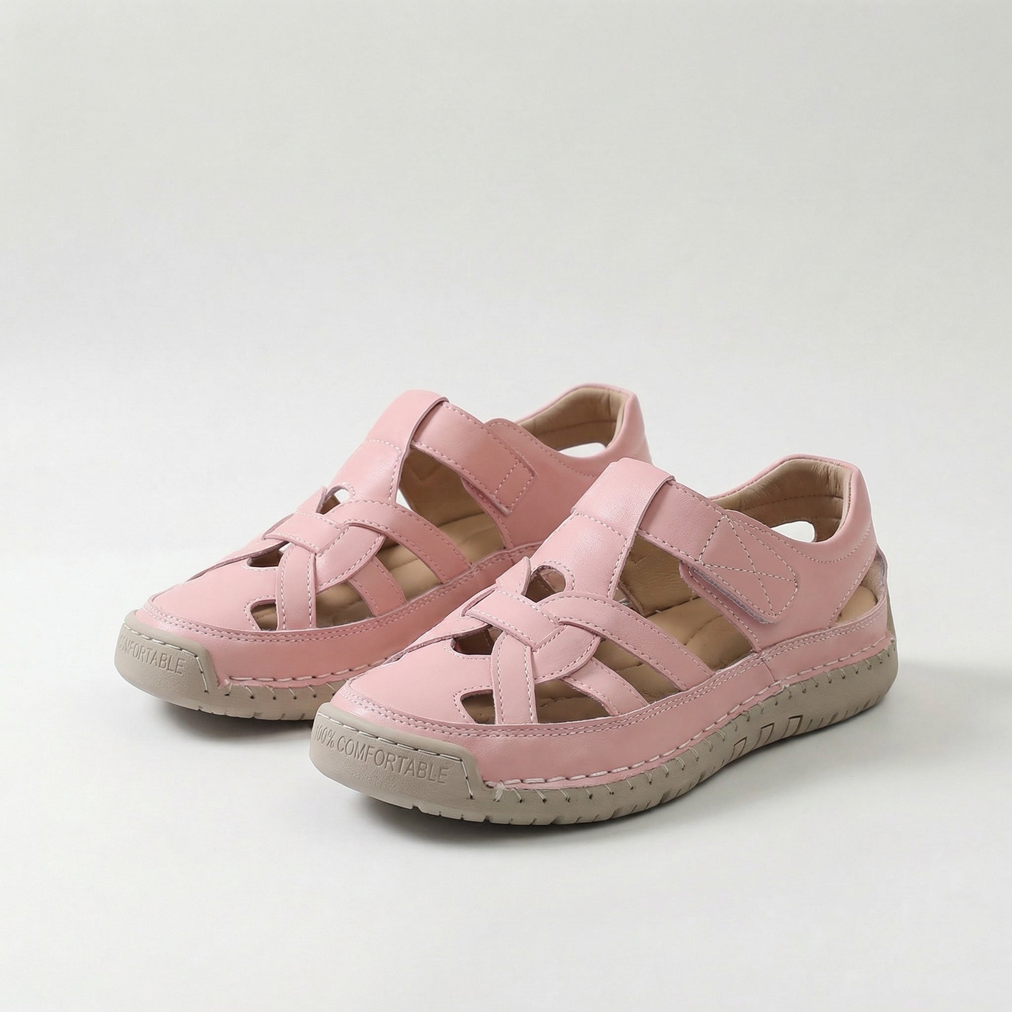 Lightweight summer sandals in pink with crisscross straps and comfort sole