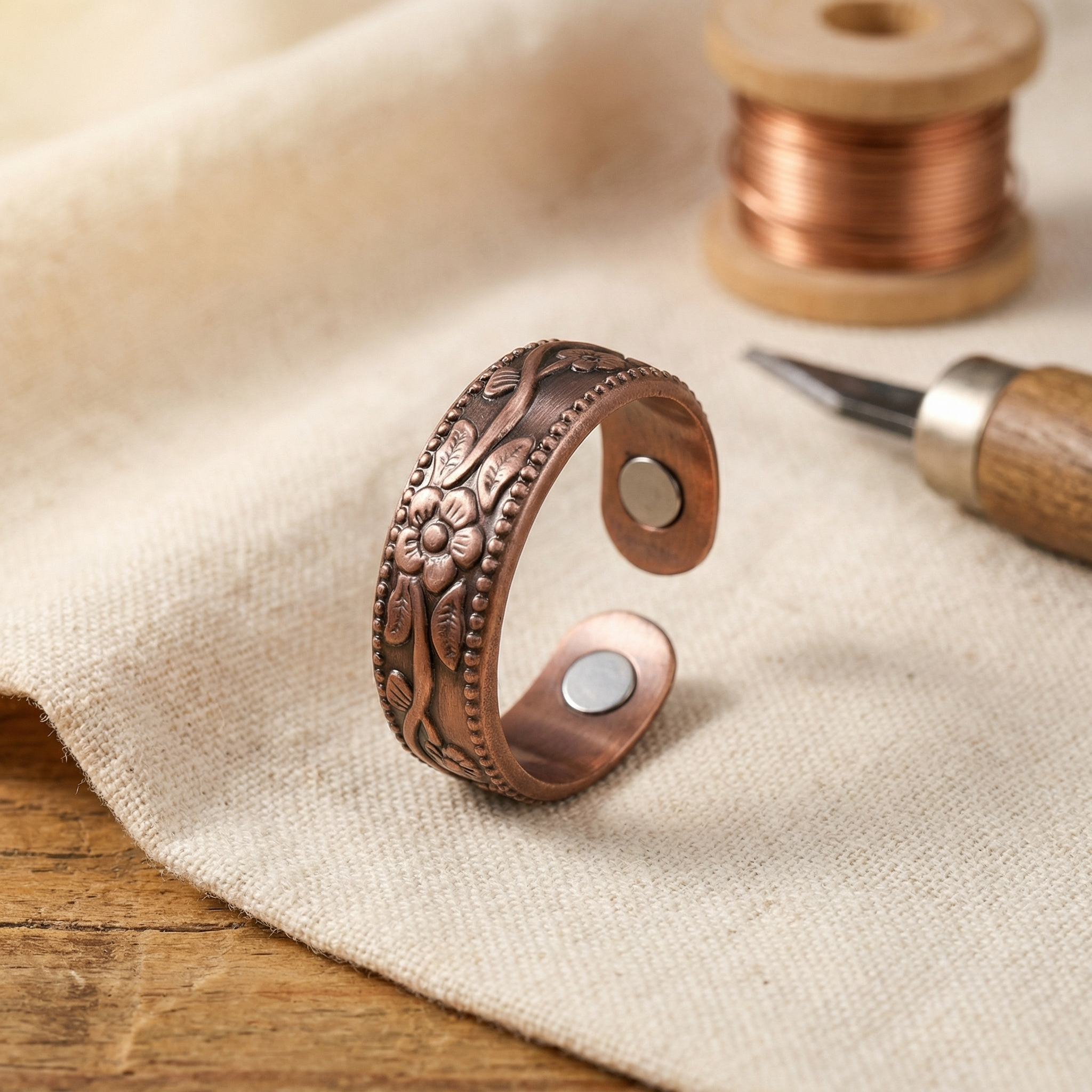Copper petal design adjustable ring with engraved floral details and two circular cutouts