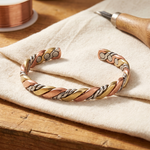 Kő Doina Bucaresti braided cuff bracelet with twisted gold, copper and silver tones