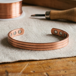 Copper cuff bracelet with oval cutout details, adjustable size