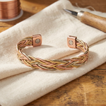 Copper braided bracelet with adjustable clasp and round rivet accents