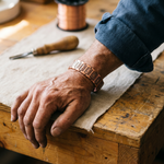 Copper bracelet on wrist with rectangular patterned link segments
