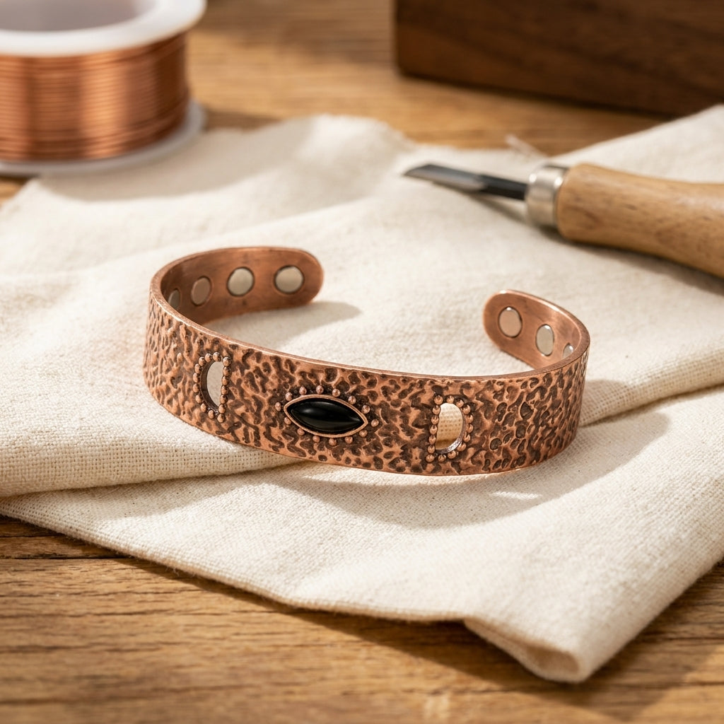 Hammered copper cuff bracelet with oval black inlay and adjustable strap