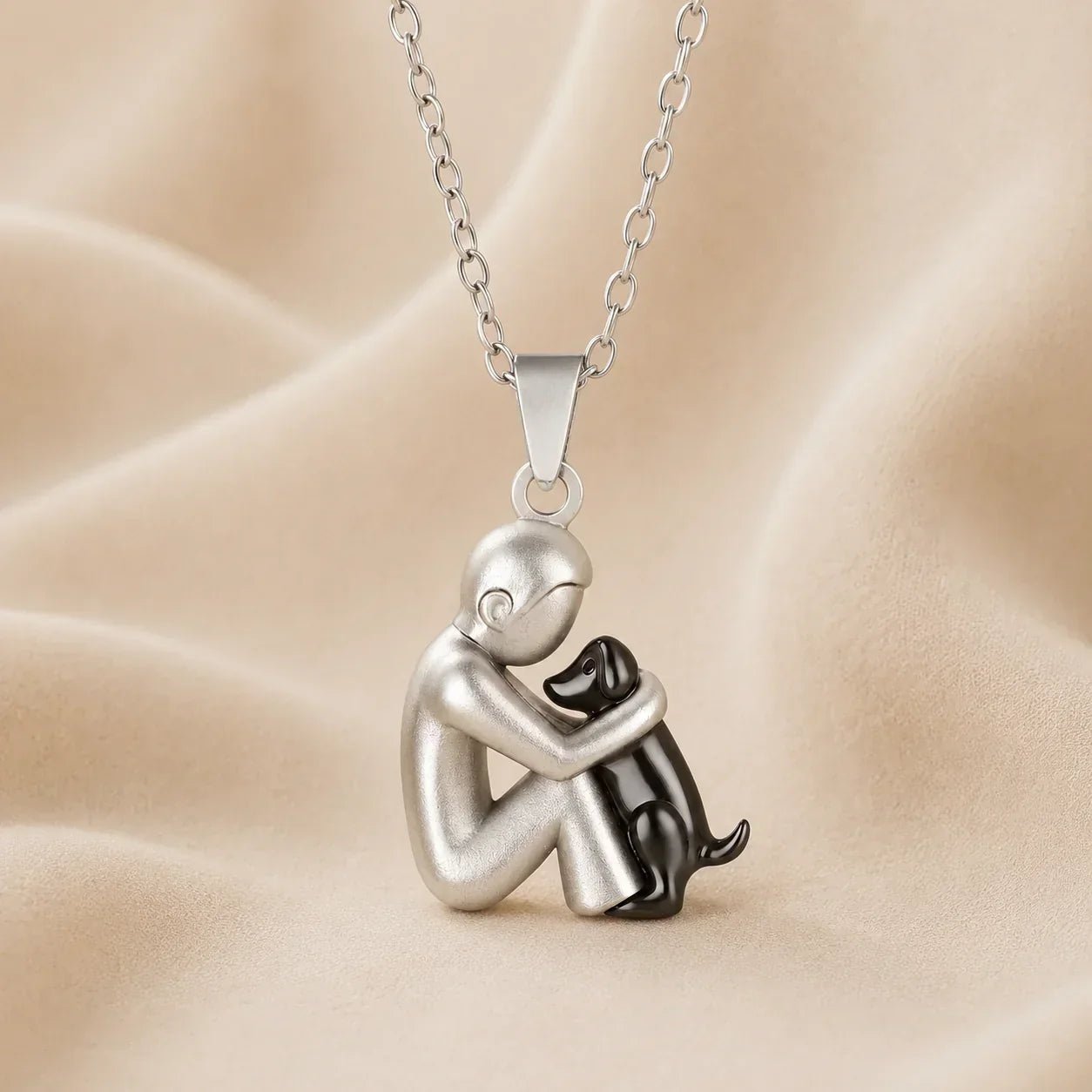Hugging cat pendant necklace, silver-tone charm with black-tone cat accents and chain