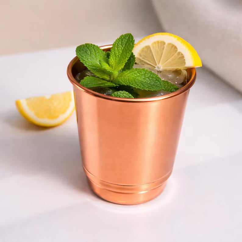 Copper 350 ml cup with fresh mint and lemon slice, no handle visible