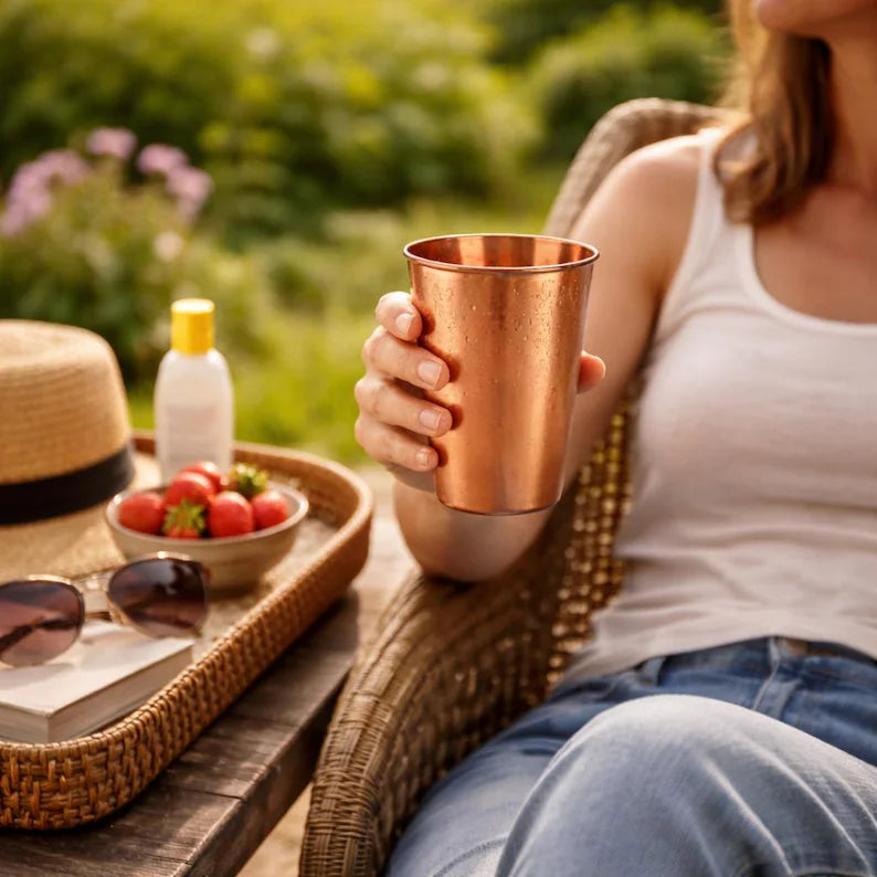 Copper 350 ml simple mug held in one hand, copper tumbler