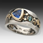 Vintage-style silver ring with large blue crystal and small round blue accents