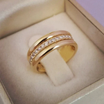 Vintage zircon ring with gold-tone band and small round clear stones