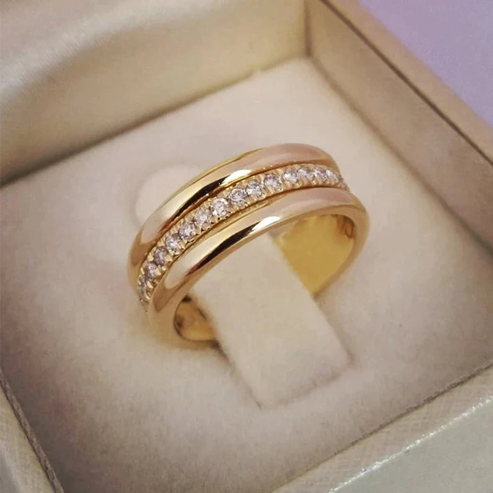 Vintage zircon ring with gold-tone band and small round clear stones