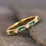 Vintage gold-tone ring with green rectangular stones and small clear accents