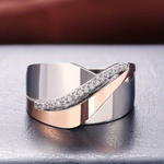 Rose gold ring with wave band and pavé stones